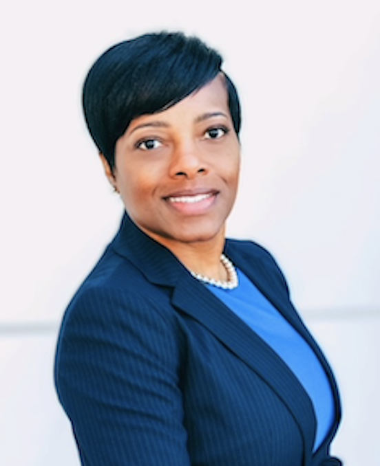 Alecia Bailey Portrait Alecia Bailey, Assurant's Global Head of Diversity, Equity & Inclusion posing for the camera in a blue suit