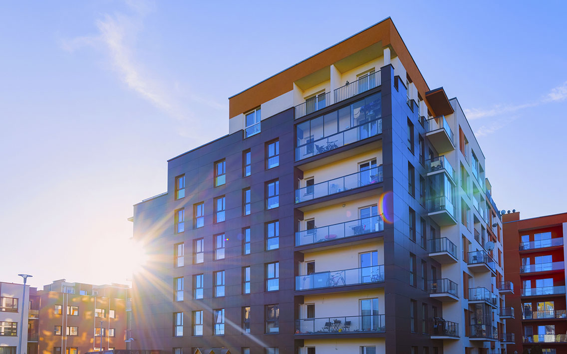 Apartment Building Side view of apartment complex at sunrise